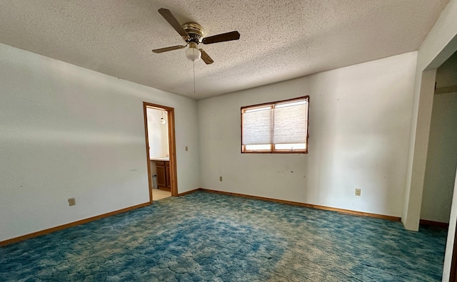 spare room featuring baseboards, carpet floors, a textured ceiling, and a ceiling fan