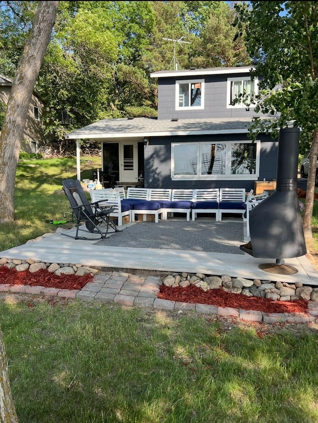 back of house featuring a yard and a patio