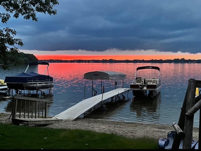 view of dock featuring a water view and boat lift