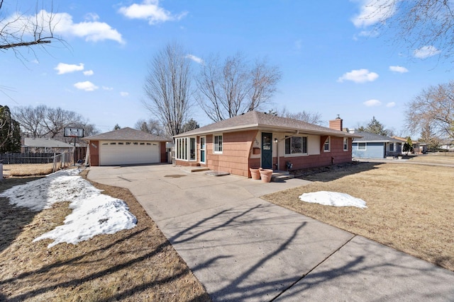 single story home featuring an outbuilding, entry steps, fence, a garage, and a chimney