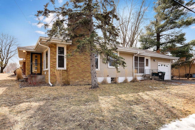 view of front of home featuring a chimney and an attached garage