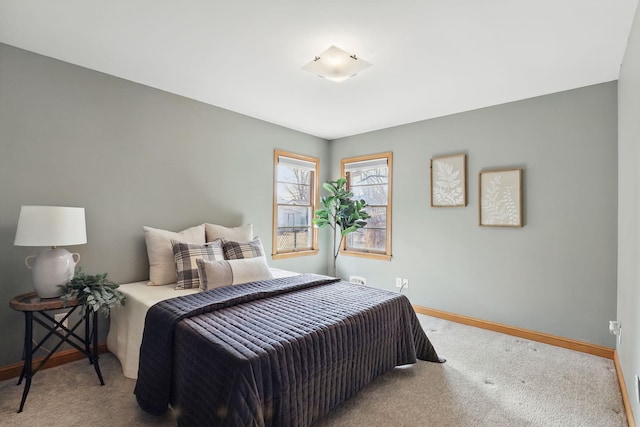 carpeted bedroom with baseboards