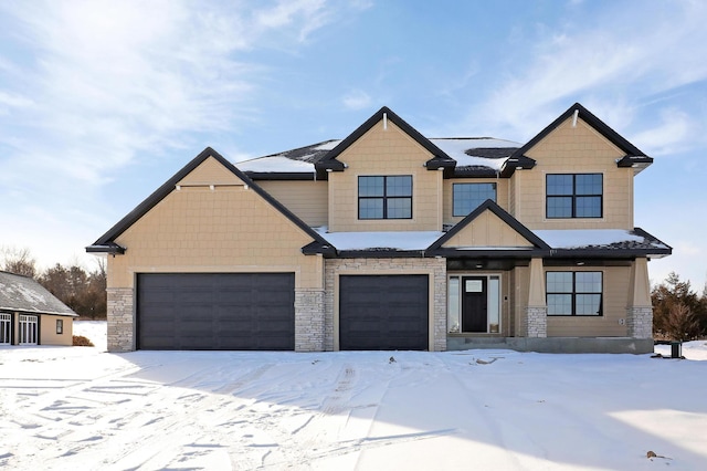 view of front of home featuring stone siding and a garage