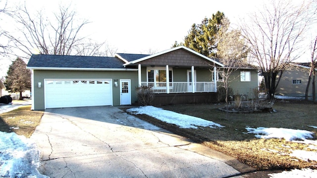 ranch-style home with an attached garage, covered porch, and driveway