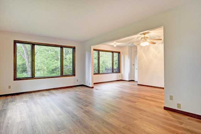21414 Tulip St NW, Oak Grove, MN 55303 - unfurnished room featuring light wood-type flooring and a ceiling fan