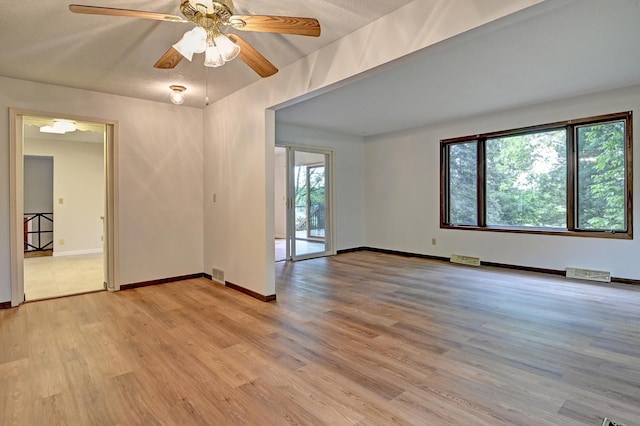 21414 Tulip St NW, Oak Grove, MN 55303 - empty room with light wood-type flooring and ceiling fan