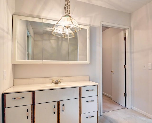 21414 Tulip St NW, Oak Grove, MN 55303 - bathroom featuring a chandelier, vanity, and tile patterned floors