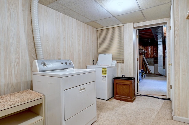 21414 Tulip St NW, Oak Grove, MN 55303 - washroom with washer and dryer, light carpet, and wood walls
