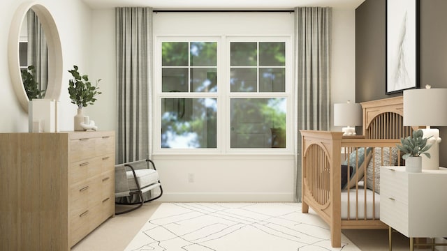 bedroom with baseboards and light carpet