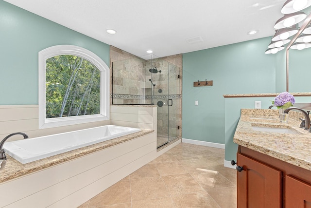 full bath featuring a shower stall, double vanity, recessed lighting, a bath, and a sink