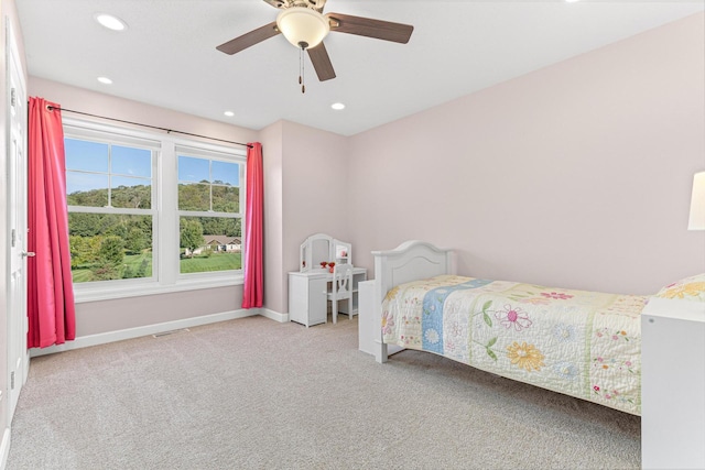 carpeted bedroom featuring a ceiling fan, visible vents, recessed lighting, and baseboards