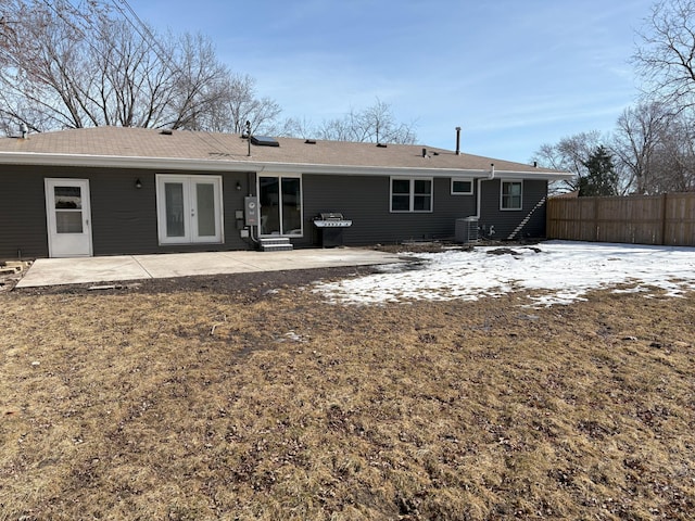 back of house with french doors, a patio, central AC, and fence