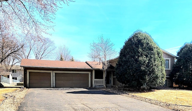 view of front facade featuring an attached garage and driveway