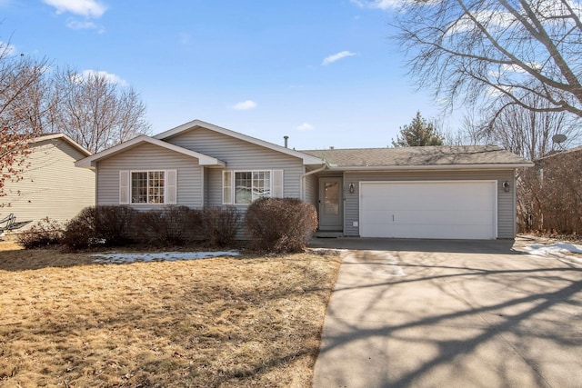 ranch-style home with concrete driveway and a garage