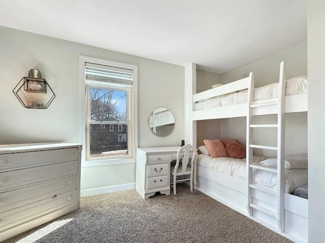 bedroom featuring baseboards and carpet