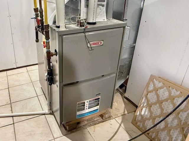 utility room featuring heating unit