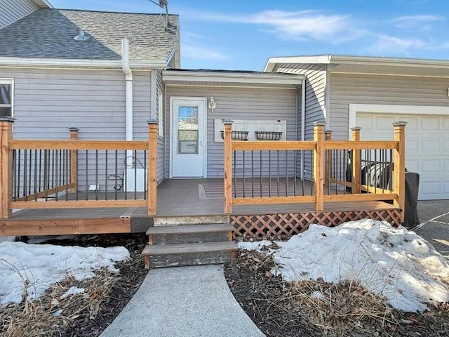 wooden terrace with a garage