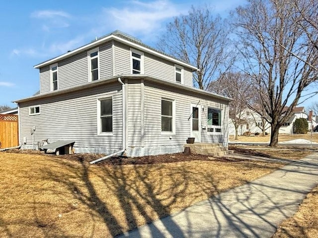 view of property exterior featuring fence