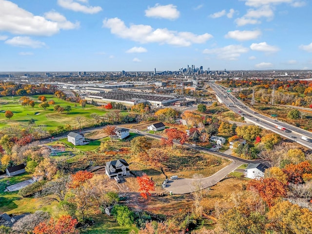 birds eye view of property featuring a city view and golf course view