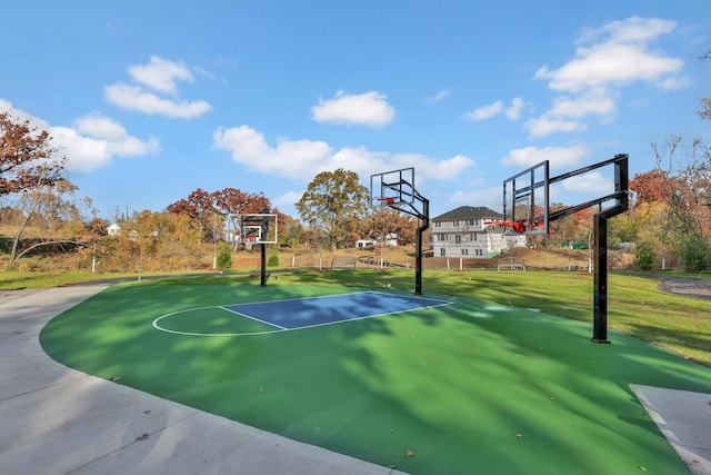 view of basketball court featuring community basketball court and a lawn
