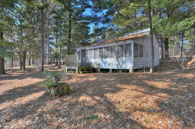 exterior space featuring a sunroom