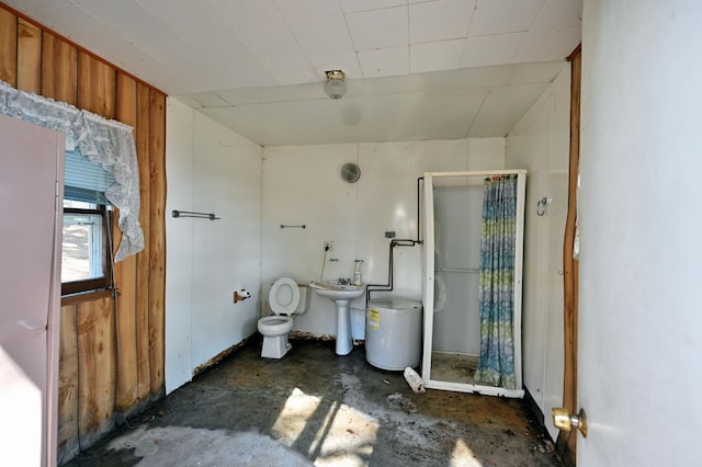 full bathroom with a sink, toilet, concrete floors, and a stall shower