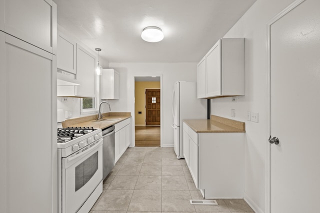 5413 42nd Ave S, Minneapolis, MN 55417 - kitchen featuring white appliances, a sink, under cabinet range hood, and white cabinets