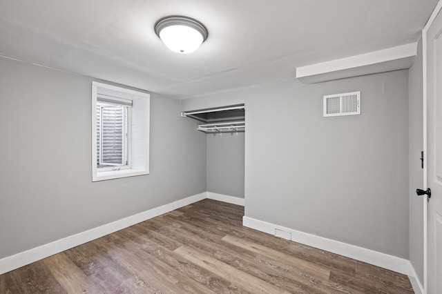 5413 42nd Ave S, Minneapolis, MN 55417 - unfurnished bedroom with baseboards, wood finished floors, and a closet