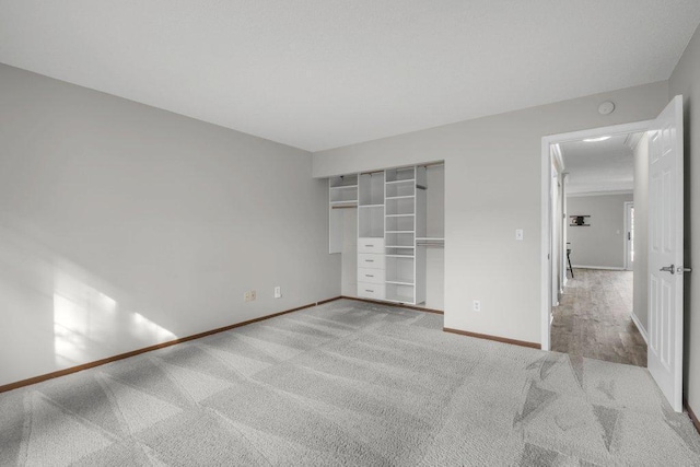 unfurnished bedroom with carpet and baseboards