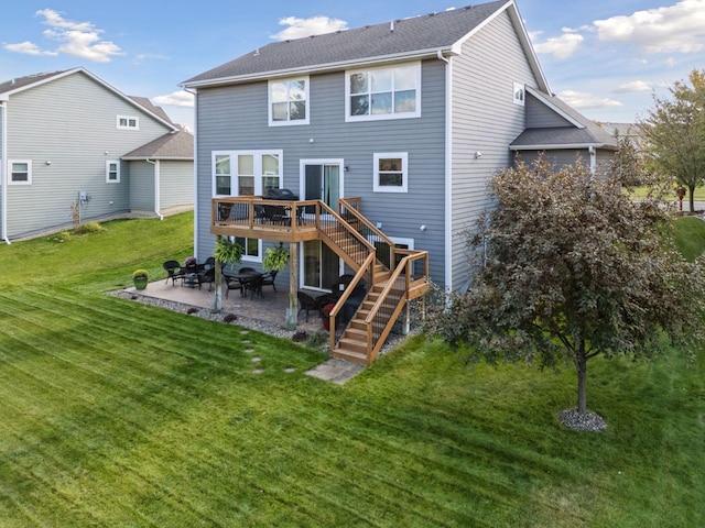 back of house with a shingled roof, stairway, a yard, a deck, and a patio