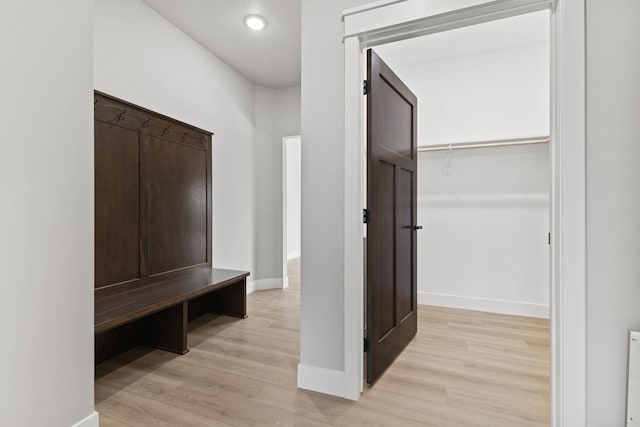 interior space featuring recessed lighting, baseboards, and light wood-style flooring