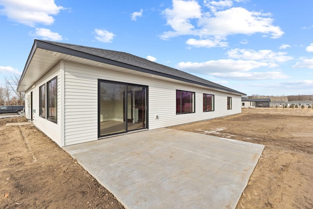 back of house with a patio area