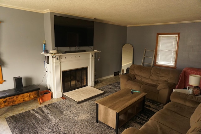 living room with a glass covered fireplace, a textured ceiling, and ornamental molding