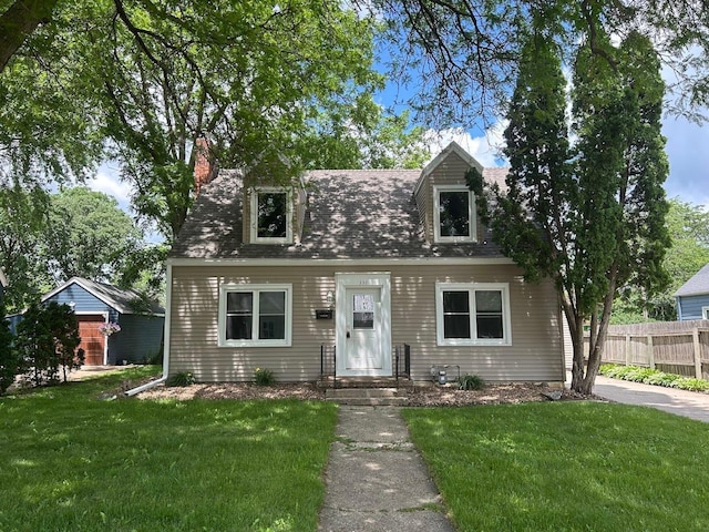 338 S St, Owatonna, MN 55060 - cape cod house featuring a chimney and a shingled roof