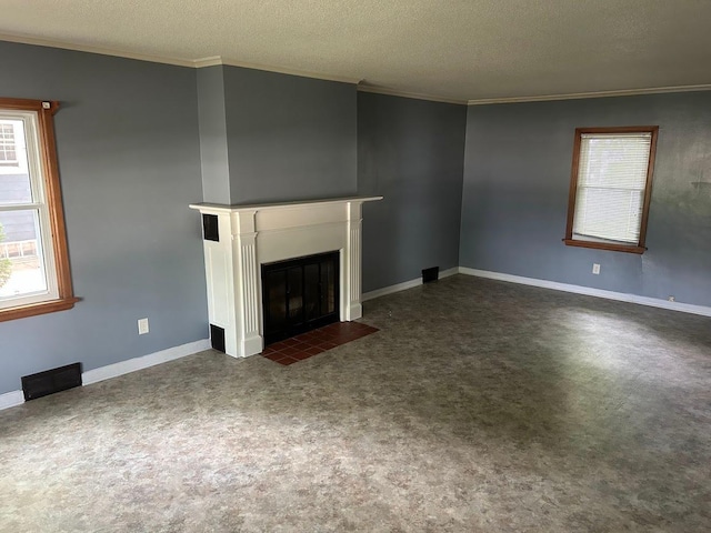 338 S St, Owatonna, MN 55060 - unfurnished living room with ornamental molding, a fireplace with flush hearth, plenty of natural light, and a textured ceiling