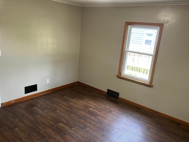 338 S St, Owatonna, MN 55060 - unfurnished room with plenty of natural light, dark wood-style floors, and ornamental molding