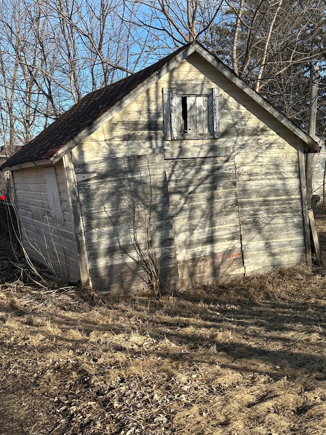 view of home's exterior with an outdoor structure