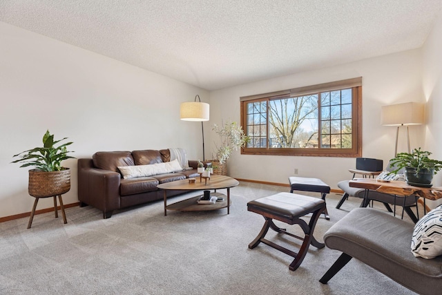 carpeted living room with baseboards and a textured ceiling