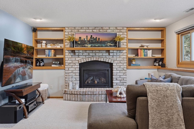 living room with a brick fireplace, carpet flooring, visible vents, and a textured ceiling