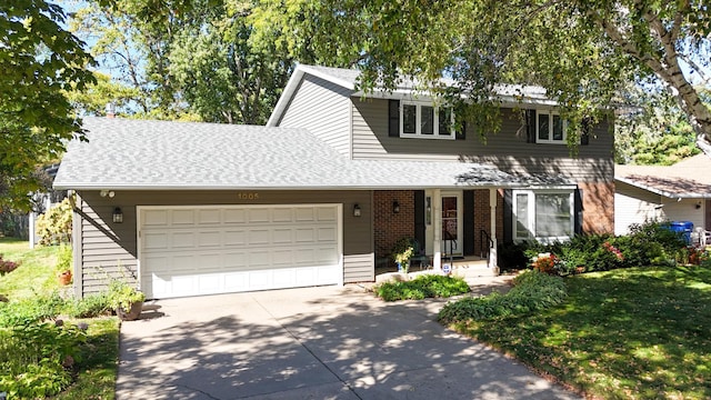 traditional home with a front lawn, roof with shingles, concrete driveway, a garage, and brick siding