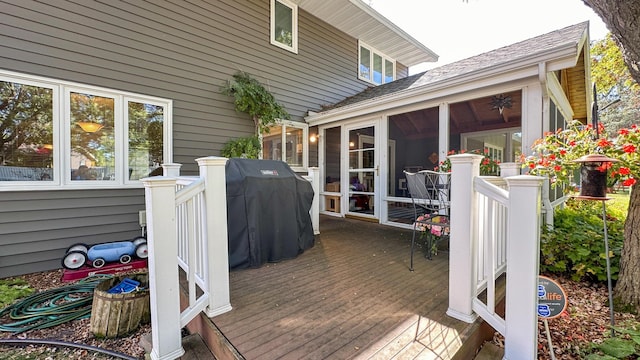 wooden terrace featuring a sunroom