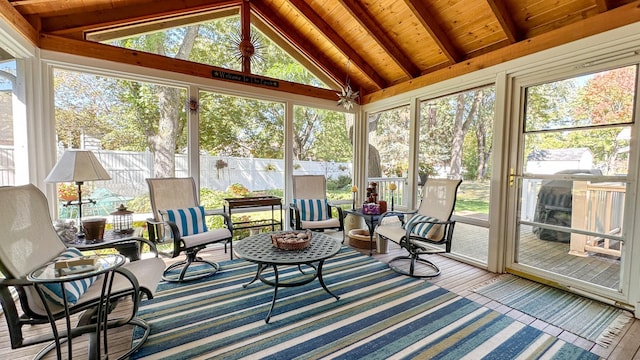 sunroom / solarium featuring wooden ceiling and lofted ceiling with beams