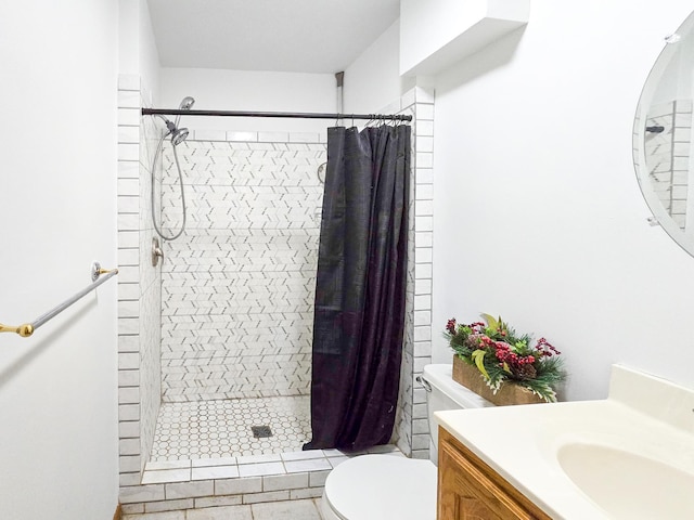 full bathroom with vanity, toilet, and a shower stall