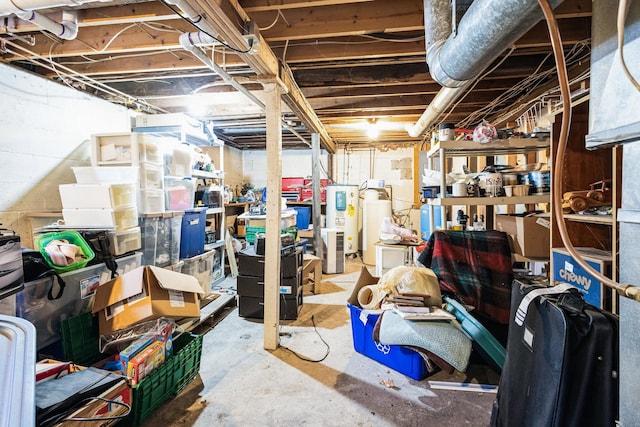 unfinished basement featuring electric water heater