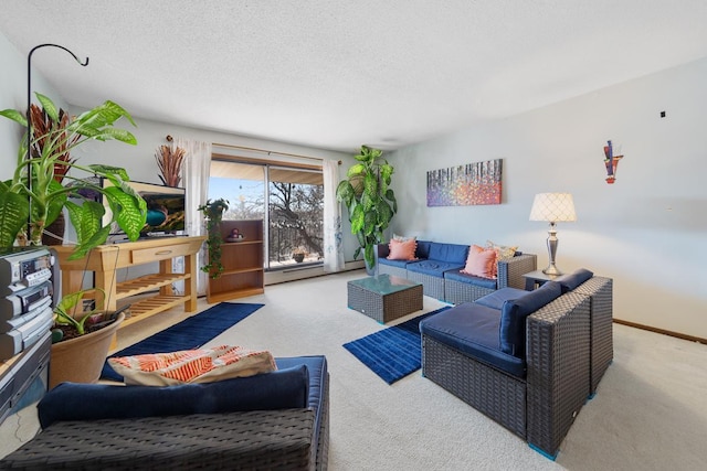 carpeted living room with a baseboard radiator, baseboards, and a textured ceiling