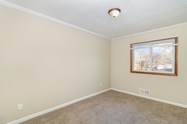 unfurnished room with visible vents, crown molding, baseboards, carpet flooring, and a textured ceiling