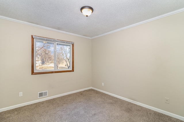 spare room featuring baseboards, visible vents, a textured ceiling, and carpet