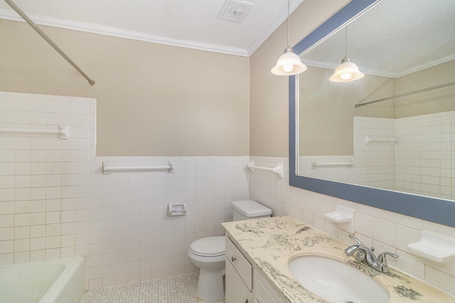 full bathroom with a bathtub, tile patterned flooring, toilet, and crown molding