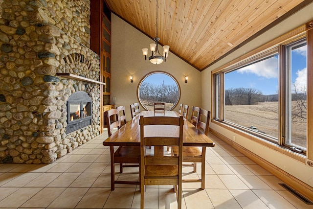 dining space with visible vents, vaulted ceiling, light tile patterned floors, wooden ceiling, and an inviting chandelier