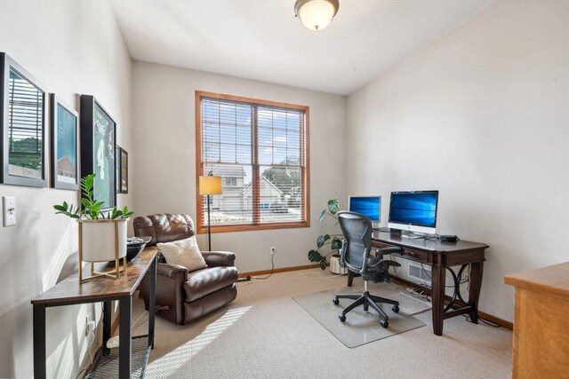 carpeted office space with baseboards